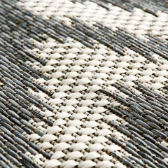 Close-up of the Diamond Grey pattern, cream diamonds against a grey flat weave