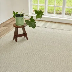 Hill n Dale Stone outdoor rug beneath a plant on a dark timber stool