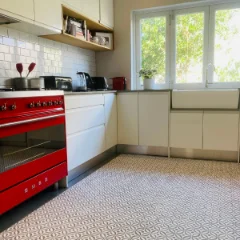 Serenity Grey patterned vinyl in a kitchen with a red range cooker