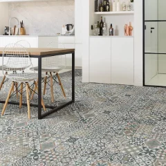 Heritage patterned vinyl in a dining area with a white table and black chairs