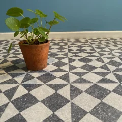 Gallery patterned vinyl with a terracotta pot standing against a teal skirting