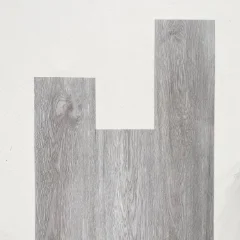 De Hoop vinyl planks in cool grey, arranged in a stepped layout on white