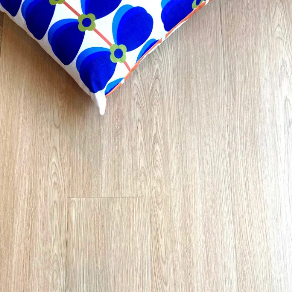 Silvermine vinyl plank flooring in pale oak, meeting a panel of blue and white patterned tiles