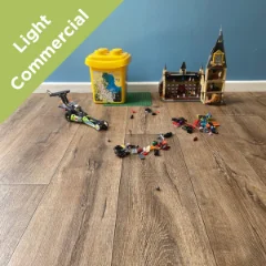 Harbour vinyl flooring with children's toys and storage bins, with a Light Commercial badge