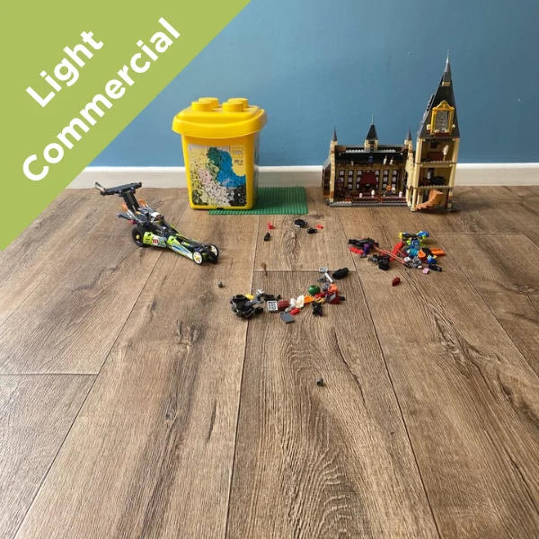 Harbour vinyl flooring with children's toys and storage bins, with a Light Commercial badge