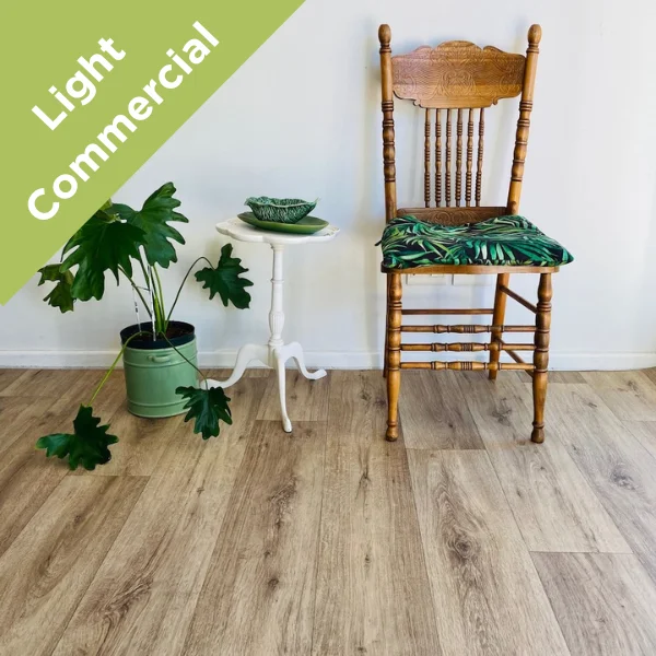 Reserve vinyl flooring beneath a wooden chair with a palm-print cushion, with a Light Commercial badge