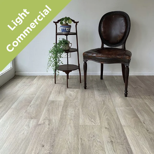 Respite vinyl flooring with a dark timber chair and tiered plant stand, with a Light Commercial badge