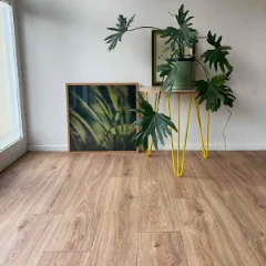 Ember vinyl flooring with yellow hairpin plant stands and framed botanical prints