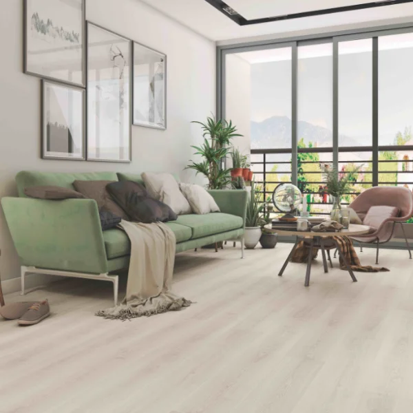 Davenport laminate in a living room with a pale green sofa and floor-to-ceiling windows