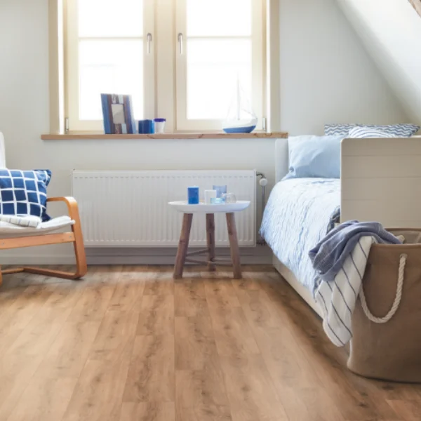 Honey Wood vinyl flooring in an attic bedroom with a dormer window and a bed