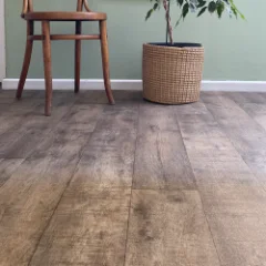 Canyon weathered-oak vinyl flooring laid wall to wall in a furnished room