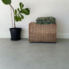 MoonStone polished-concrete vinyl flooring laid wall to wall in a furnished room