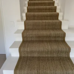 Seagrass Herringbone installed on a stairacse