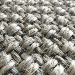 Close-up of the Sisal Heather basketweave, showing the flecked grey and cream fibre